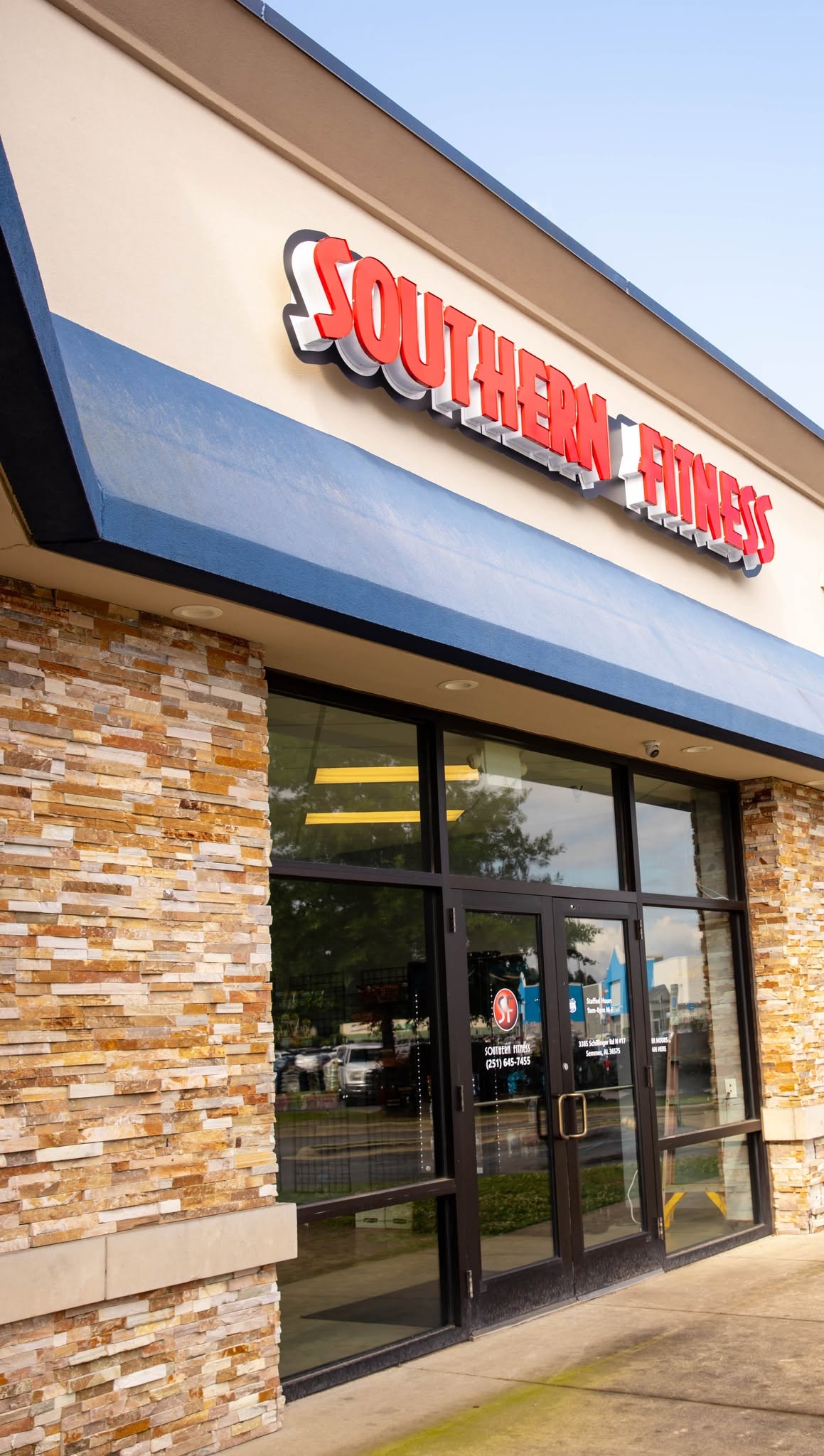 Southern Fitness entrance and red storefront sign